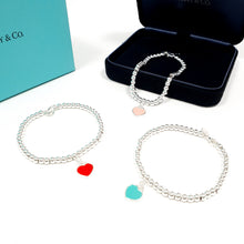 Cargar imagen en el visor de la galería, Pulsera de cuentas T&amp;Co con placa de corazón (Nuevo Modelo)
